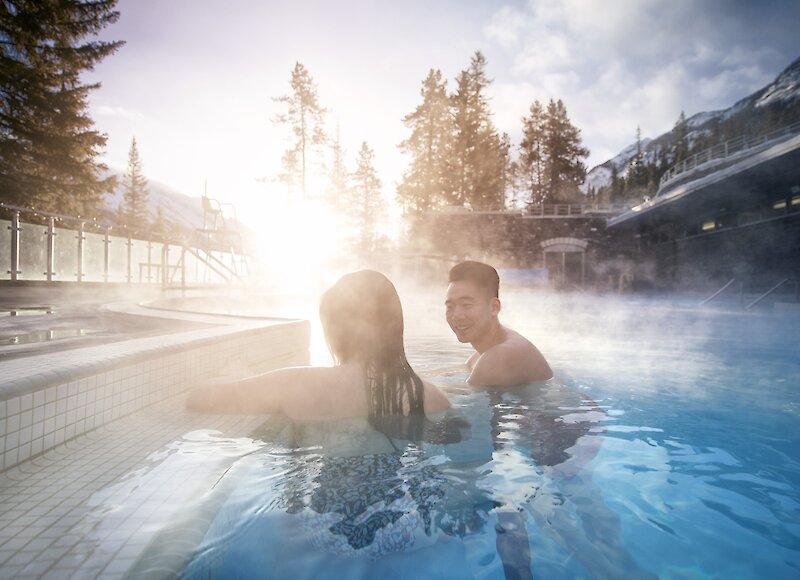 Couple enjoying a soak in the Banff Upper Hot Springs