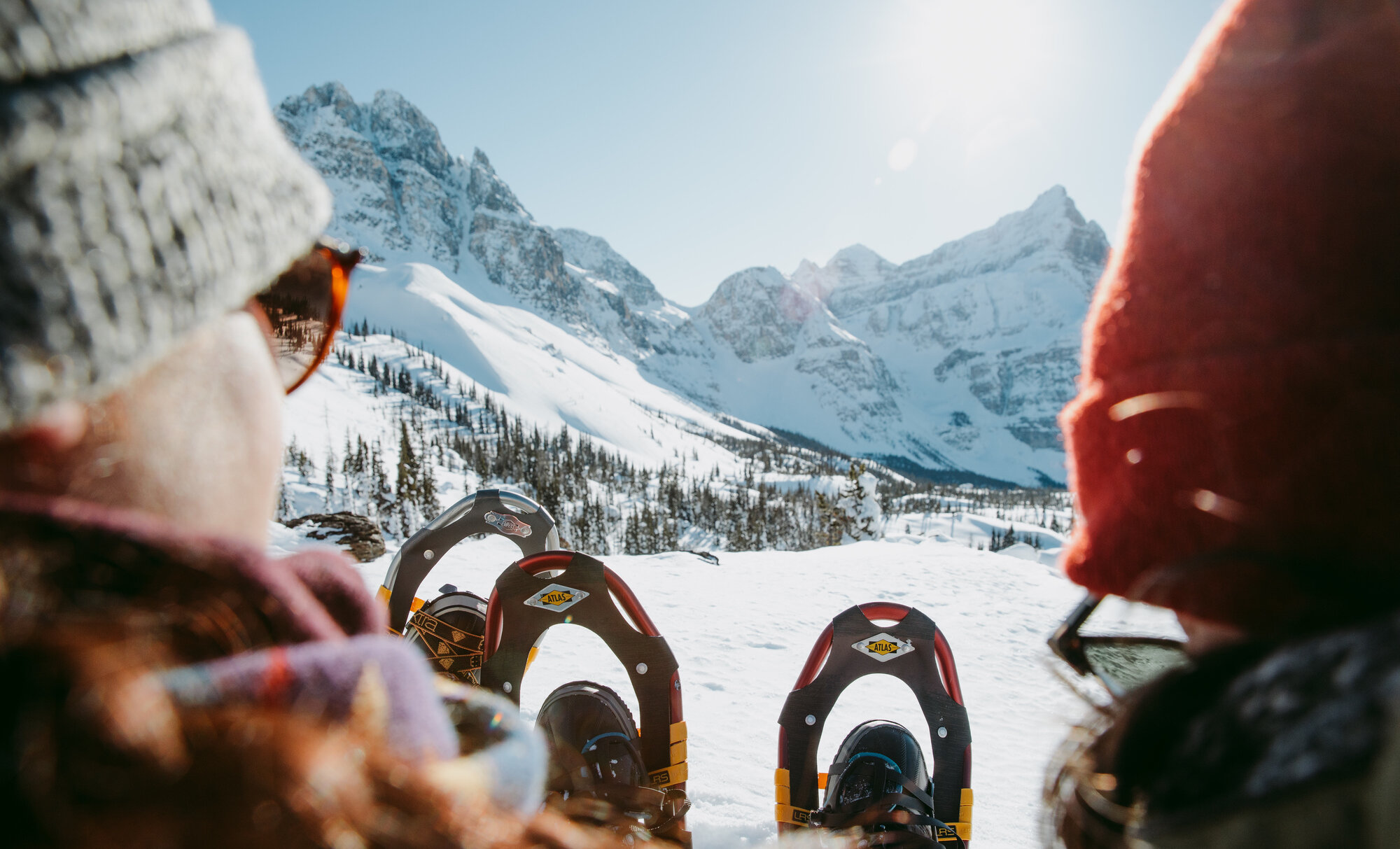 People at relaxing after snowshoeing in Banff