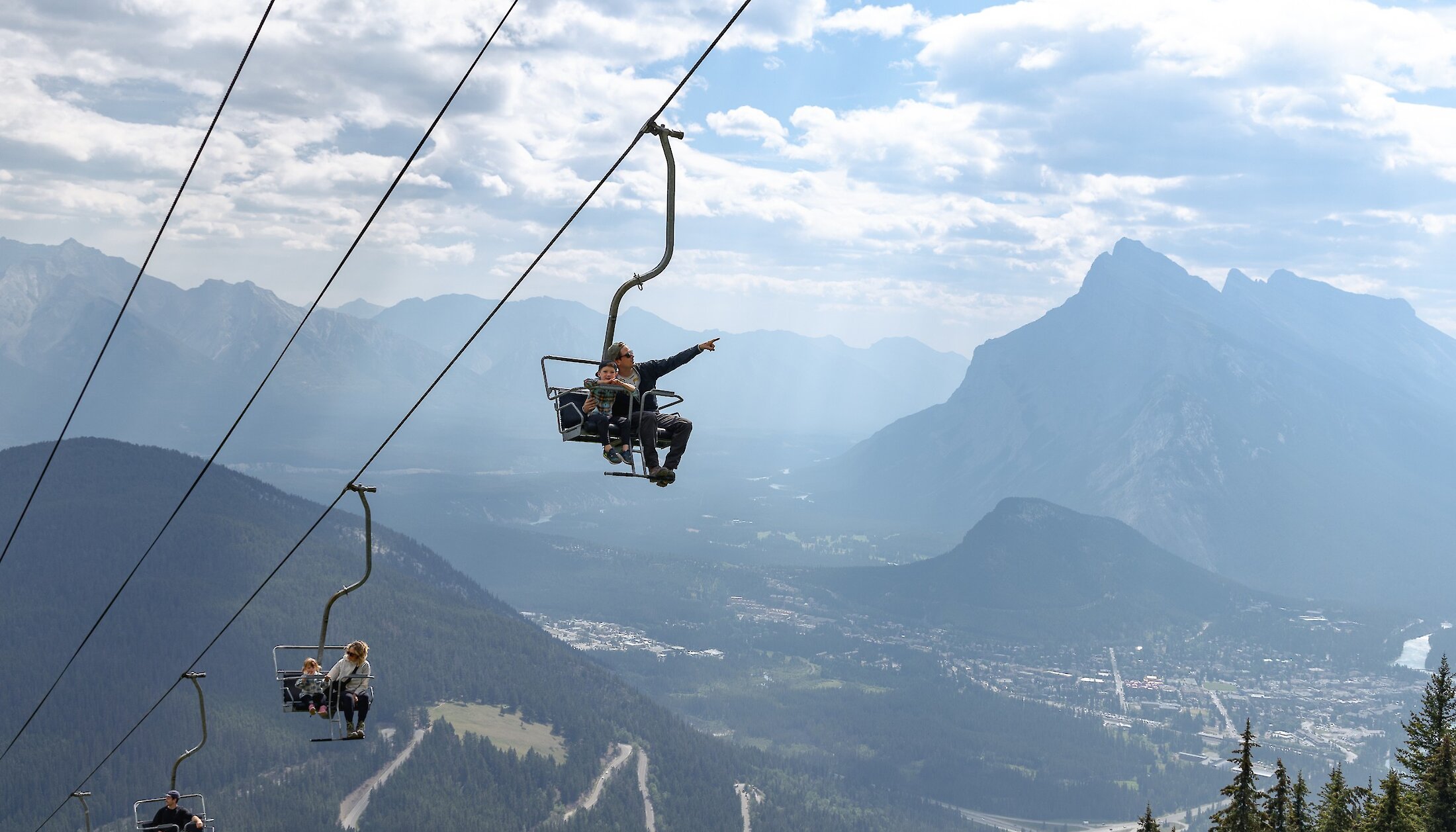 Enjoying the views on the way up Mount Norquay chairlift