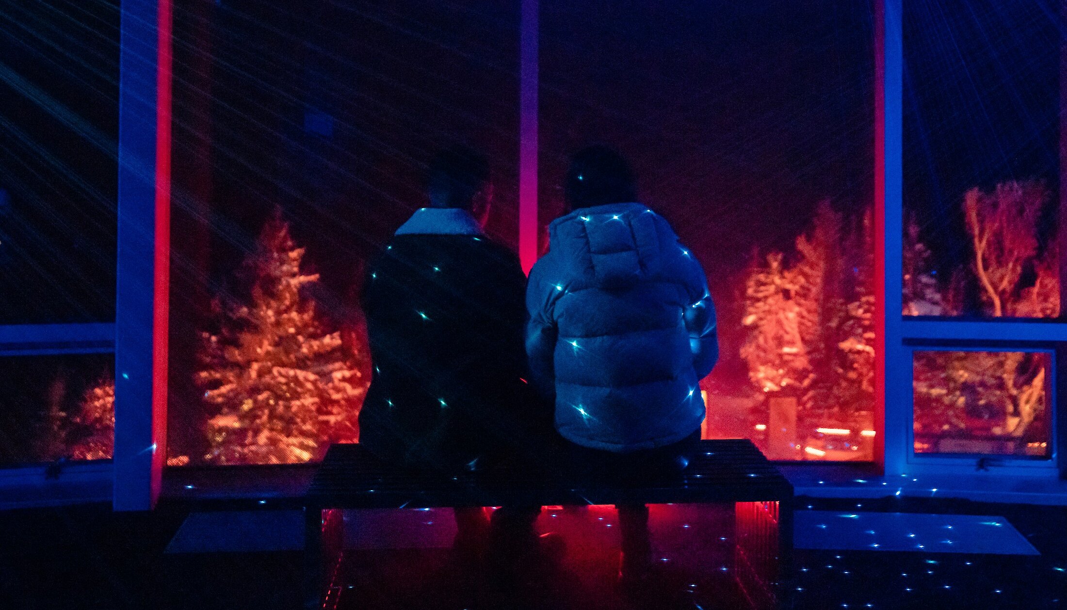 A couple enjoying the view at the Banff Gondola nightrise