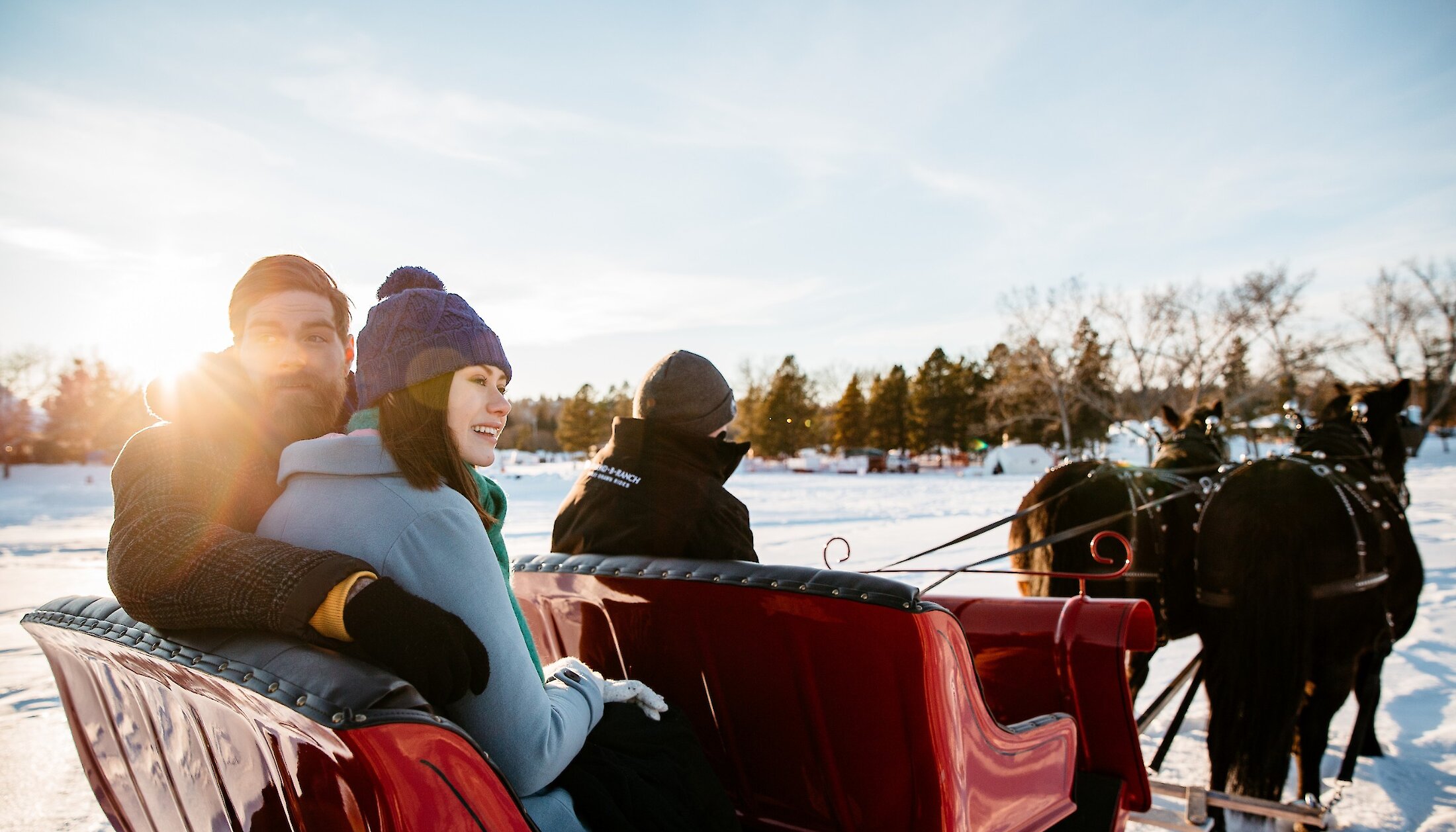 A couple on the private sleigh ride in Banff