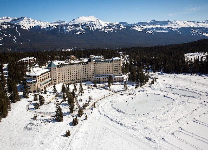 An aerial view of Chateau Lake Louise and the ice rink