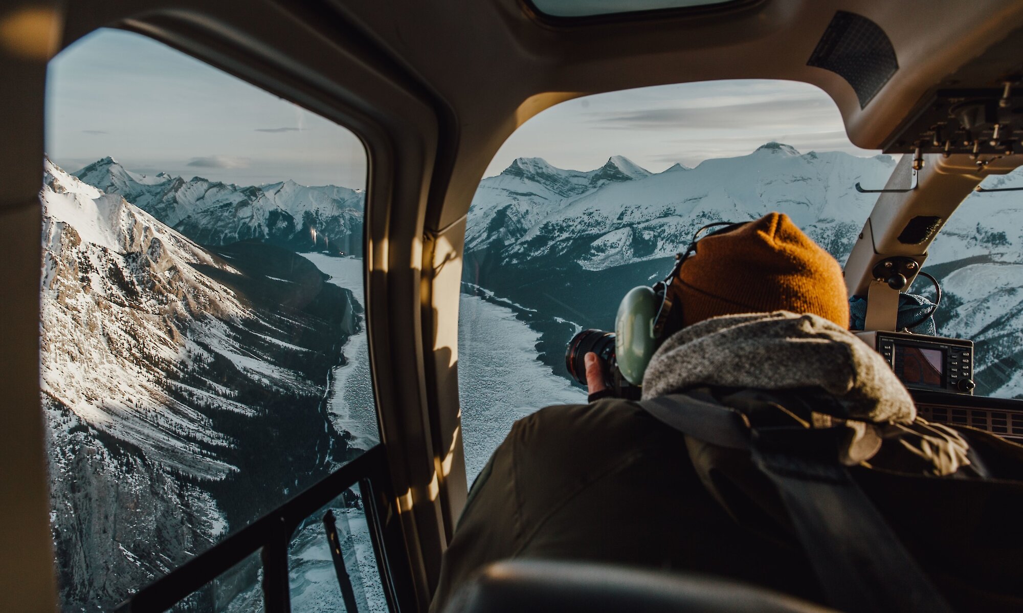 A photographer taking photos of Abraham Lake in the Canadian Rockies