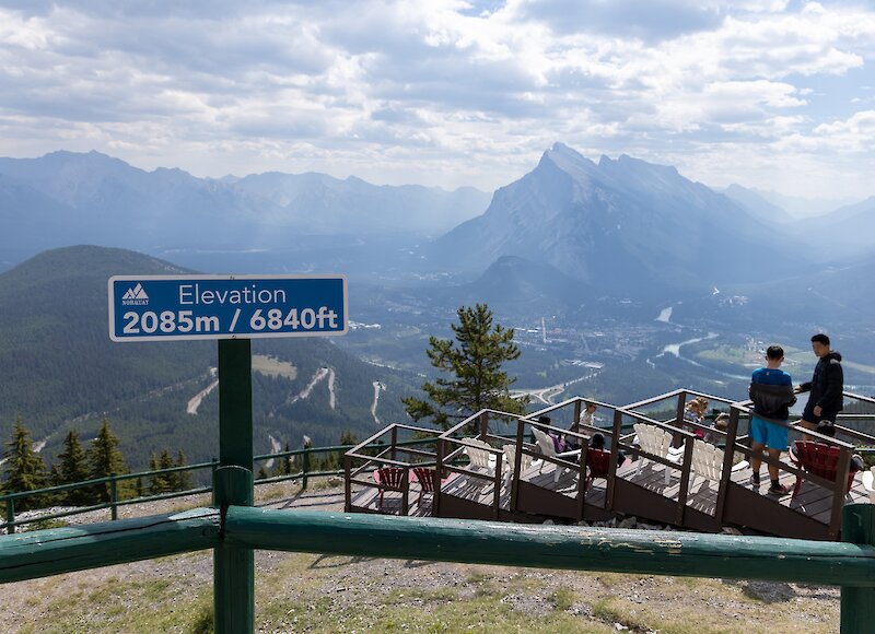 A couple admiring the view from the top of the Mount Norquay Chairlift